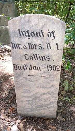 A restored granite headstone with crisp lettering